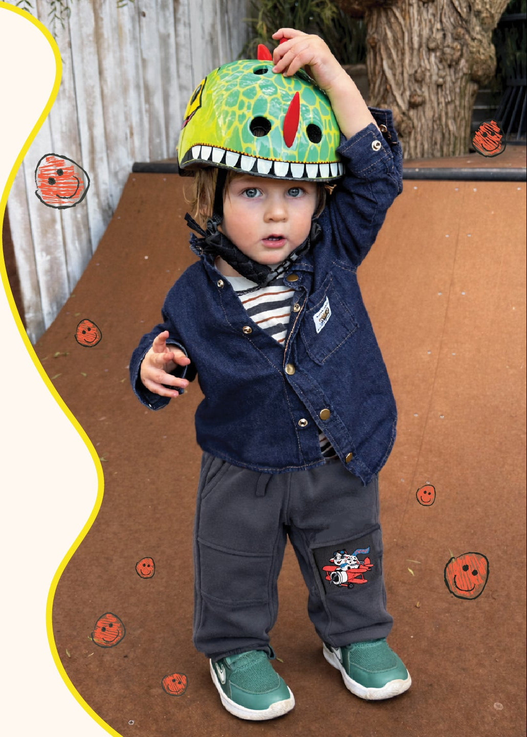 Child wearing a colorful helmet on a playground with 'Let's Play!' text.