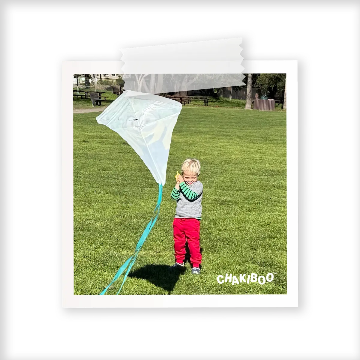 A boy flying a kite in red Chakiboo™ RenewaKnee™ double knee joggers
