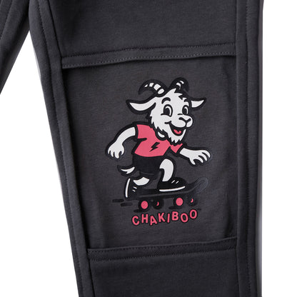 Close up of a revealed inner knee layer on slate gray Chakiboo™ RenewaKnee™ joggers featuring a skateboarder graphic